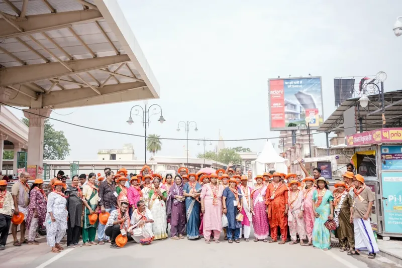 Our travel group posing together on the road near the Ayodhya temple complex
